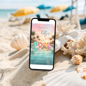 May include: A smartphone displays a colorful invitation for "Katty's Birthday POOL PARTY" with a beach scene. The phone rests on a sandy beach with seashells and coral. The background shows the ocean, palm trees, and umbrellas.