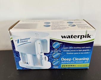 System do czyszczenia jamy ustnej Waterpik Personal Oral Cleaning Irrigator do zębów WP-60W Vintage Teeth Floss