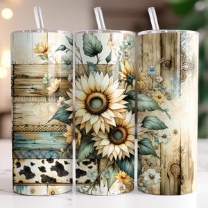 May include: Three stainless steel tumblers with lids and straws. Each tumbler features a different design with a rustic wood background and a floral arrangement of sunflowers, daisies, and greenery.