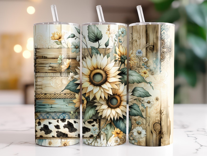 May include: Three stainless steel tumblers with lids and straws. Each tumbler features a different design with a rustic wood background and a floral arrangement of sunflowers, daisies, and greenery.