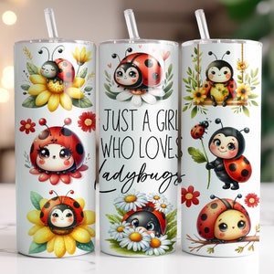 May include: Three stainless steel tumblers with a white background and colorful ladybug designs. The tumblers have lids and straws. The text "Just a girl who loves ladybugs" is printed on the middle tumbler.