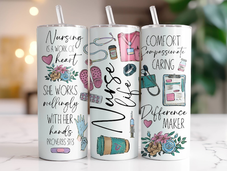 May include: Three white tumblers with colorful designs and inspirational quotes related to nursing. The tumblers feature images of medical equipment, flowers, and hearts. The text on the tumblers includes "Nursing is a work of heart", "Comfort Compassionate Caring", and "Difference Maker".
