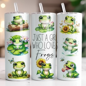 May include: Three white stainless steel tumblers with a green frog design. The tumblers have lids and straws. The middle tumbler has the text "Just a girl who loves frogs" printed on it.