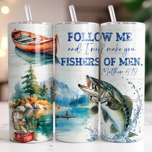 May include: Three stainless steel tumblers with a white background and watercolor designs. The tumbler on the left features a wooden boat on a lake. The tumbler in the middle features a watercolor scene of a lake with a mountain in the background. The tumbler on the right features a fish jumping out of the water. All three tumblers have the text "FOLLOW ME and I will make you FISHERS OF MEN. Matthew 4:19" printed on them.