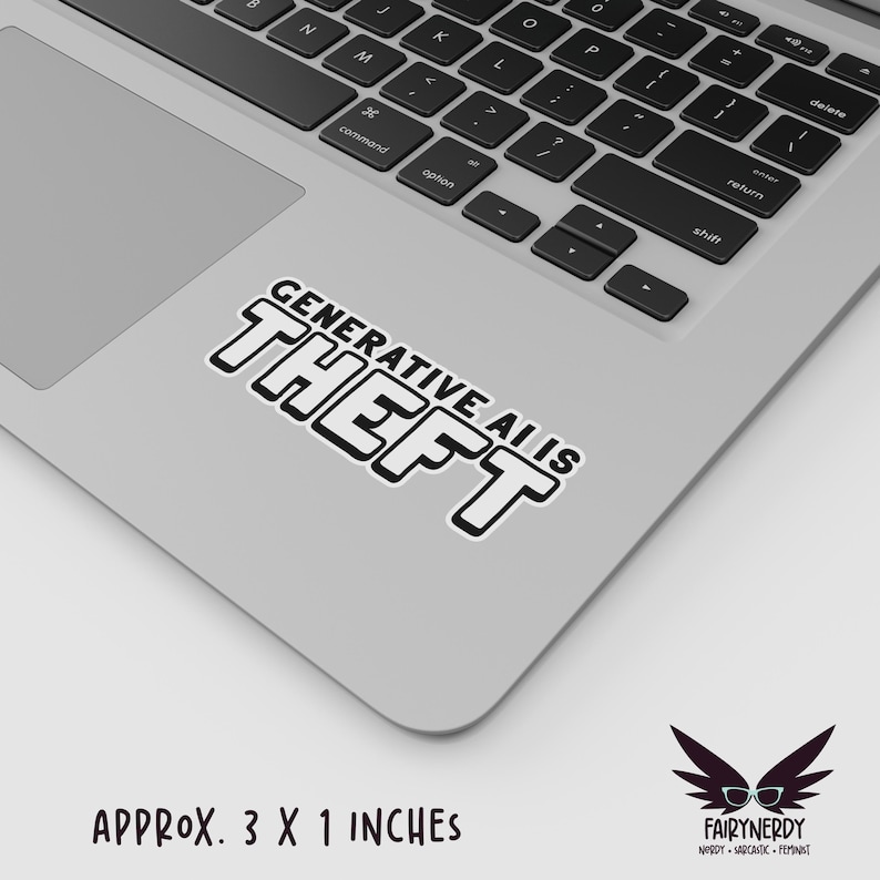 A black and white sticker with blocky text that reads, "Generative AI is theft." Shown on a MacBook.