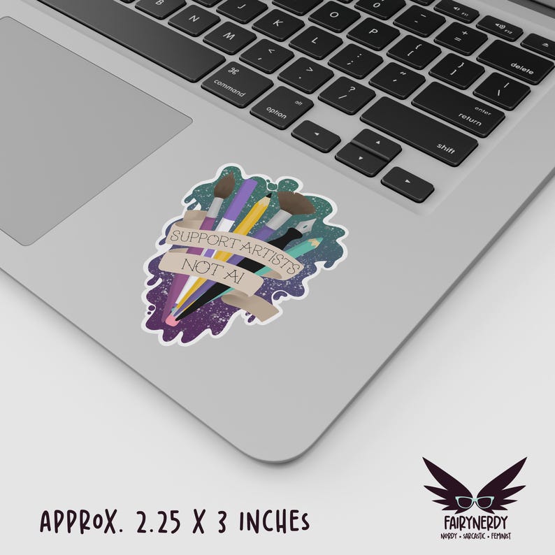 A vinyl sticker with a digital illustration of multiple art tools like paintbrushes, pencils, and markers with a banner that reads, "Support Artists, Not AI." The entire design is on a paint-like green and purple background. Shown on a MacBook.