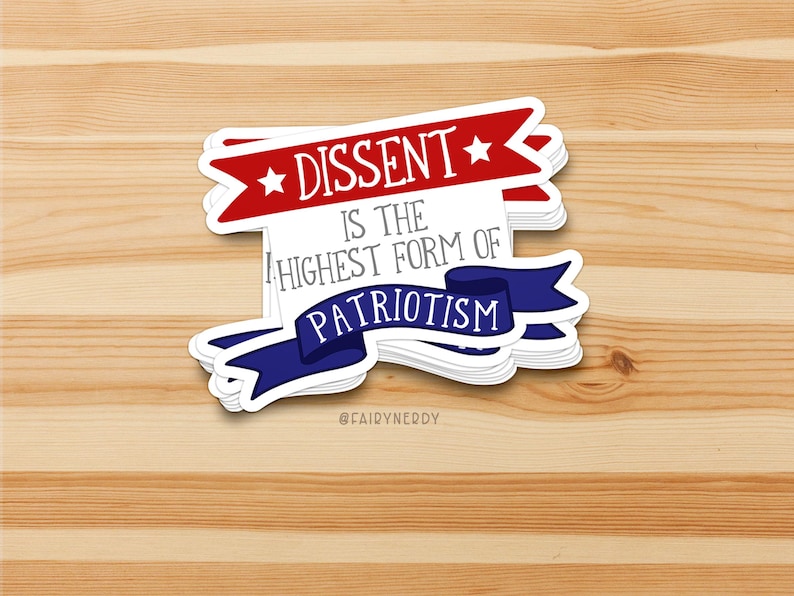 A stack of vinyl stickers with a patriotic design. A red banner at the top reads "Dissent" between two stars; gray text in the middle reads "is the highest form of;" and a blue banner at the bottom reads, "Patriotism."