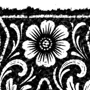 May include: Black and white floral design with a large, detailed flower at the center. The design includes stylized leaves and a textured background, creating a vintage or antique aesthetic. The image is a close-up of a decorative pattern.