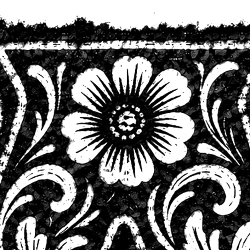 May include: Black and white floral design with a large, detailed flower at the center. The design includes stylized leaves and a textured background, creating a vintage or antique aesthetic. The image is a close-up of a decorative pattern.