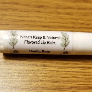 May include: White tube of Nana's Keep It Natural Flavored Lip Balm in Vanilla Bean flavor.