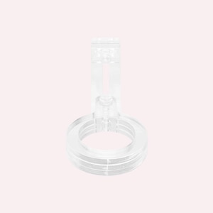 May include: A clear plastic ring stand with a vertical post and a screw adjustment. The stand is designed to hold a round object, such as a bottle or a jar.