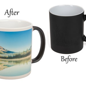 May include: A black magic mug with a white interior. The mug changes color when hot liquid is poured inside. The mug shows a panoramic image of a mountain reflected in a lake. The text "After" is above the mug and the text "Before" is below the mug.