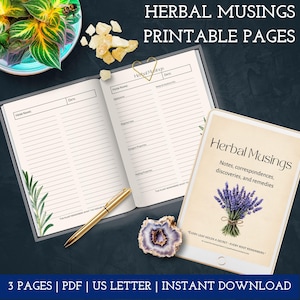 May include: An open notebook and a tablet display the text "Herbal Musings" with printable pages. The notebook has lined pages with prompts for herb names and notes. A gold pen and a decorative stone are also visible.