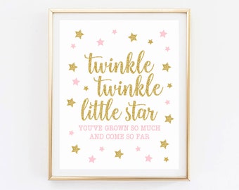 May include: Gold glitter print with the text "twinkle twinkle little star you've grown so much and come so far" surrounded by pink and gold stars.