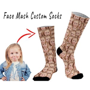 May include: A pair of custom socks with a face mash design. The socks are white with a black toe and heel. The design features a repeated pattern of a young girl's face.