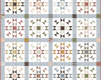 May include: A quilt with a patchwork design featuring a variety of floral patterns in shades of pink, brown, green, and blue. The quilt is made up of 12 squares, each with a different pattern. The background of the quilt is a light blue color.