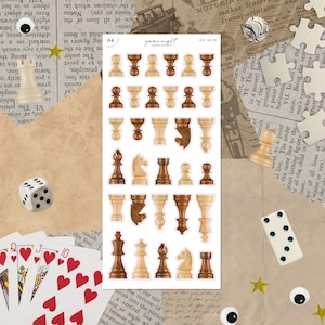 May include: A sheet of chess piece stickers in various shades of brown and beige. The sticker sheet has the text "game night" and the code "175-M014". Other game pieces like dice, playing cards, and dominoes are also visible.