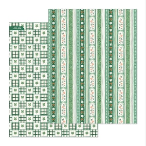 May include: Two sheets of patterned paper. One features a grid of green and white squares with shamrocks. The other has vertical stripes of green, white, and floral designs. The text "C75-826" is visible on the left sheet.