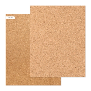 May include: Two rectangular cork boards with a natural, speckled appearance. One board is slightly smaller and overlaps the larger one. The smaller board has a white label with the text "C25-029".