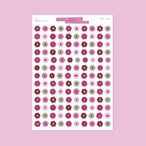 May include: A sheet of alphabet stickers, each letter inside a flower shape. The flowers are in shades of pink, red, and green. The text "LETTERS & MORE" and "BADIE'S STICKERS" are at the top. The sheet is labelled "#05 BERRY NICE".