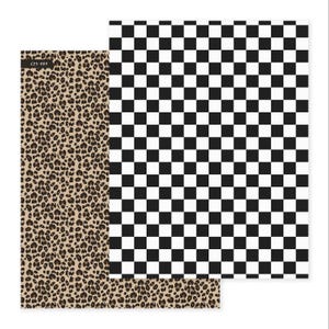 May include: Two sheets of patterned paper. One has a black and white chequerboard design. The other has a tan and brown leopard print. The top left corner of the leopard print paper has the text "C25-889".