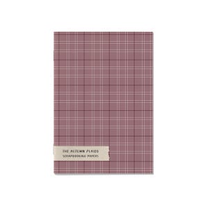 May include: A rectangular scrapbook paper pad with a mauve plaid pattern. The paper has a grid of thin black and white lines. A label at the bottom reads "THE AUTUMN PLAIDS SCRAPBOOKING PAPERS".