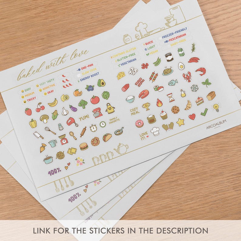 May include: A white sticker sheet featuring colorful food and kitchen-themed icons, including fruits, vegetables, cooking utensils, and text like "baked with love" and "ARCOALBUM". The sheet includes various labels for dietary needs and meal types.