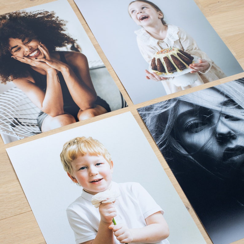 May include: Four different photos of people. The first photo shows a person with long curly brown hair wearing a black tank top. The second photo shows a young girl with long blonde hair wearing a white dress holding a cake. The third photo shows a young person with short blonde hair wearing a white shirt holding a white flower. The fourth photo shows a black and white photo of a person's face.