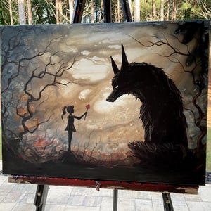 May include: An original painting on canvas depicts a dark, surreal scene. A young figure offers a flower to a large, shadowy wolf. The artwork features a muted color palette with a focus on the figures and the surrounding forest.