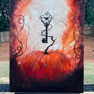 May include: A rectangular canvas painting featuring a large, vibrant orange pumpkin at the bottom center. A dark, ornate, vintage-style key extends upward from the pumpkin stem, surrounded by swirling, smoky, dark red and black abstract patterns.