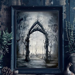 May include: A framed black and white gothic art print. The artwork depicts a dark, misty forest scene with a skeletal archway as the focal point. Bare trees and a path lead into the distance, creating a haunting atmosphere. The frame is black.