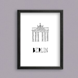 May include: Black and white line drawing of the Brandenburg Gate in Berlin, Germany. The text "BERLIN" is below the image.