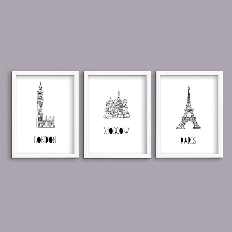 May include: Three black and white illustrations of famous landmarks. The first illustration is of Big Ben in London, the second is of St. Basil's Cathedral in Moscow, and the third is of the Eiffel Tower in Paris.