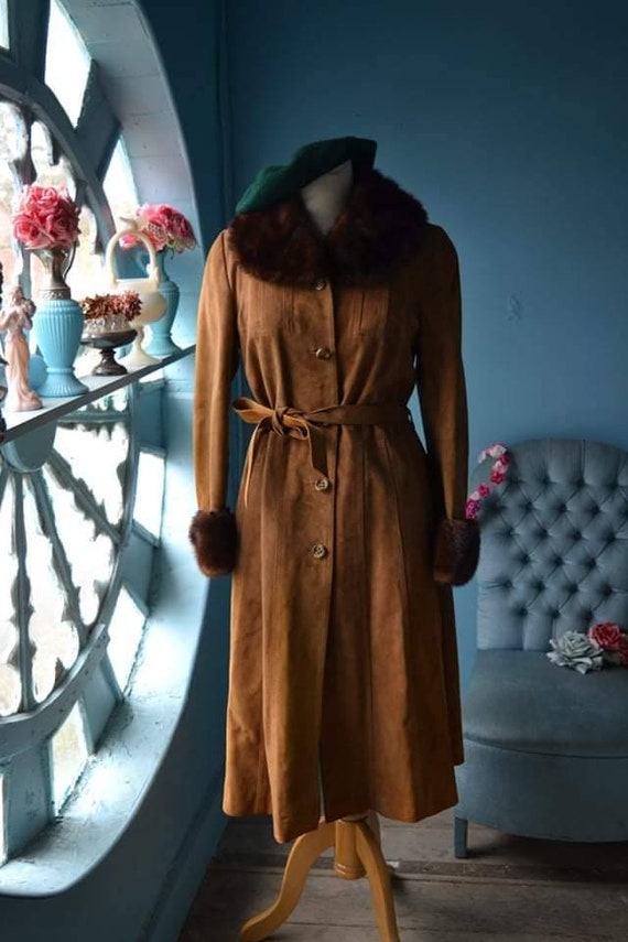 Leather coat and fur 70s .