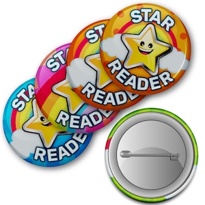 May include: Four colourful round buttons with a rainbow, a smiling yellow star, and the text "STAR READER". The buttons are stacked on top of each other. A fifth button with a silver pin is shown separately.