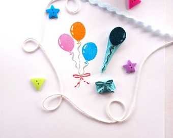 Balloon rubber stamp with bow.