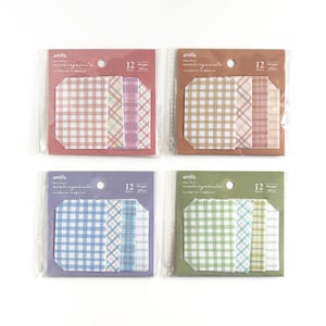 May include: Four packs of decorative sticky notes in various colors. Each pack contains 12 pieces with different plaid and striped patterns. The colors include pink, tan, purple, blue, and green. The brand name "amifa" is printed on each package.