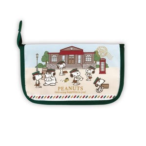 May include: A rectangular pouch featuring a Peanuts design with Snoopy and friends in front of a building. The pouch has a green border and a loop. The text "PEANUTS Delivering happiness to you!" is printed on the pouch.