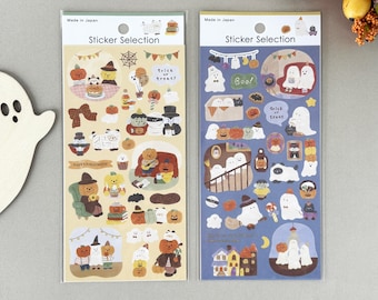 May include: Two sticker sheets with Halloween-themed illustrations. One sheet has a beige background with pumpkins, bears, and the text "Happy Halloween". The other sheet has a blue background with ghosts and the text "Boo!".