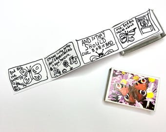 May include: A whimsical comic strip featuring a butterfly character named "Bad Bob." The strip is hand-drawn in black ink and includes text bubbles. A small rectangular image of a butterfly on purple flowers is also present.