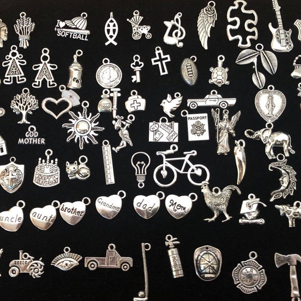 Lot of 100 Assorted New Age Silver Tone Milagros Charms,for altars, jewelry, mixed media art, and much more.