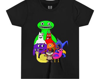 Peut inclure: T-shirt noir avec un motif coloré d'un groupe de monstres de dessin animé. Les monstres sont verts, rouges, blancs, violets, bleus, roses et jaunes.