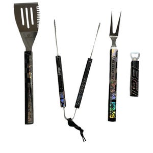 May include: A set of four grilling tools with black handles featuring a hockey stick design. The tools include a spatula, tongs, a fork, and a bottle opener. The handles are decorated with a holographic pattern and the names "VBAUER", "CLIFFORD", and "BIG E" are printed on them.