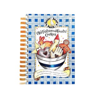 May include: A spiral-bound cookbook titled Old-Fashioned Country Cookies by Gooseberry Patch. The cover features a blue and white plaid pattern, a bowl filled with various cookie shapes, and a banner with the text Yummy recipes, tips, traditions, how-tos, and sweet memories... everything Cookies!
