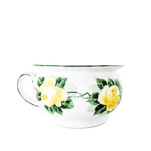 May include: White ceramic planter with a green rim and handle, adorned with yellow rose floral designs and green leaves. The planter has a rounded shape and is suitable for indoor or outdoor use.
