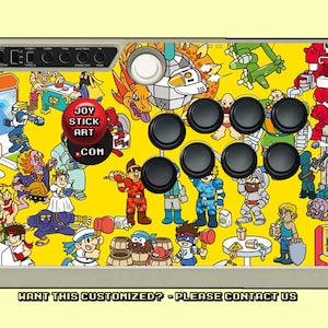 May include: A yellow arcade joystick with a colorful design featuring cartoon characters. The joystick has eight black buttons and a white ball top. The text "JOY STICK ART .COM" is printed on the joystick.