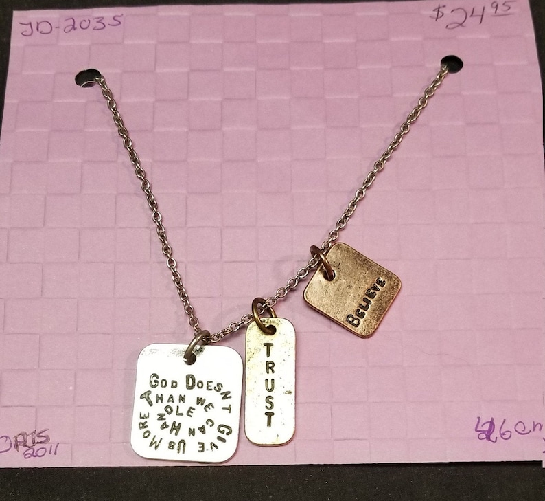 necklace Silver chain with dangle silver and bronze tags with words ORIS
