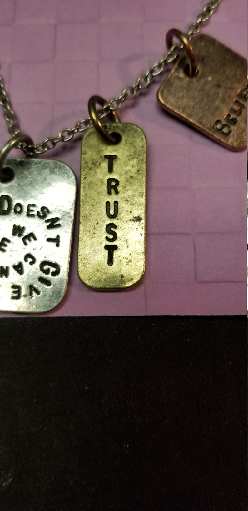 necklace Silver chain with dangle silver and bronze tags with words ORIS