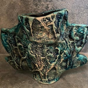turquoise vase with stone structure