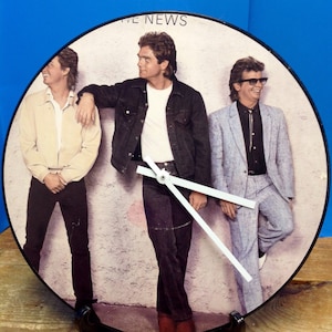 Huey Lewis and the News Front Cover Album Rock Clock